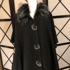 Black winter poncho with faux fur lining.